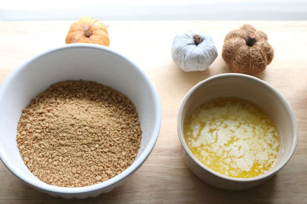 graham crackers and butter to make the crust for pumpkin cheesecake bars