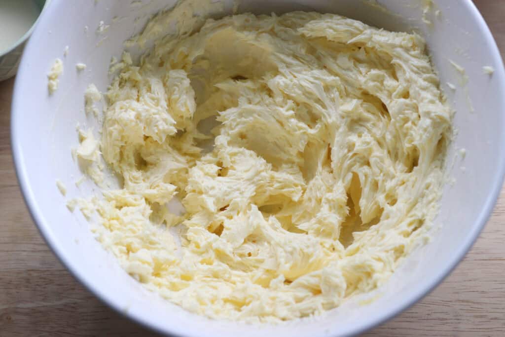 butter and cream cheese mixed together to make icing for the pumpkin cheesecake bars with fresh milled crust