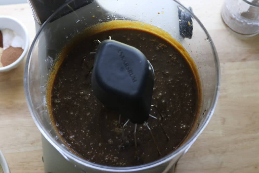 molasses, water, and eggs added to the mixing bowl to make fresh milled gingerbread cake with cream cheese icing