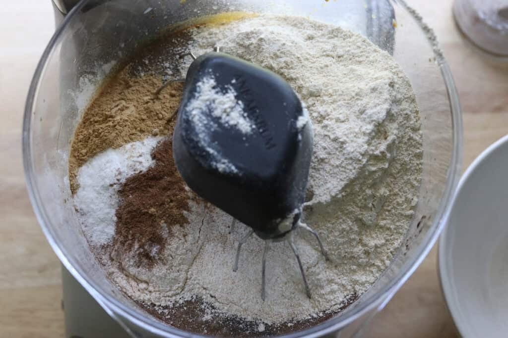 flour, cinnamon, ginger, and cloves in a mixing bowl to make fresh milled gingerbread cake with cream cheese icing