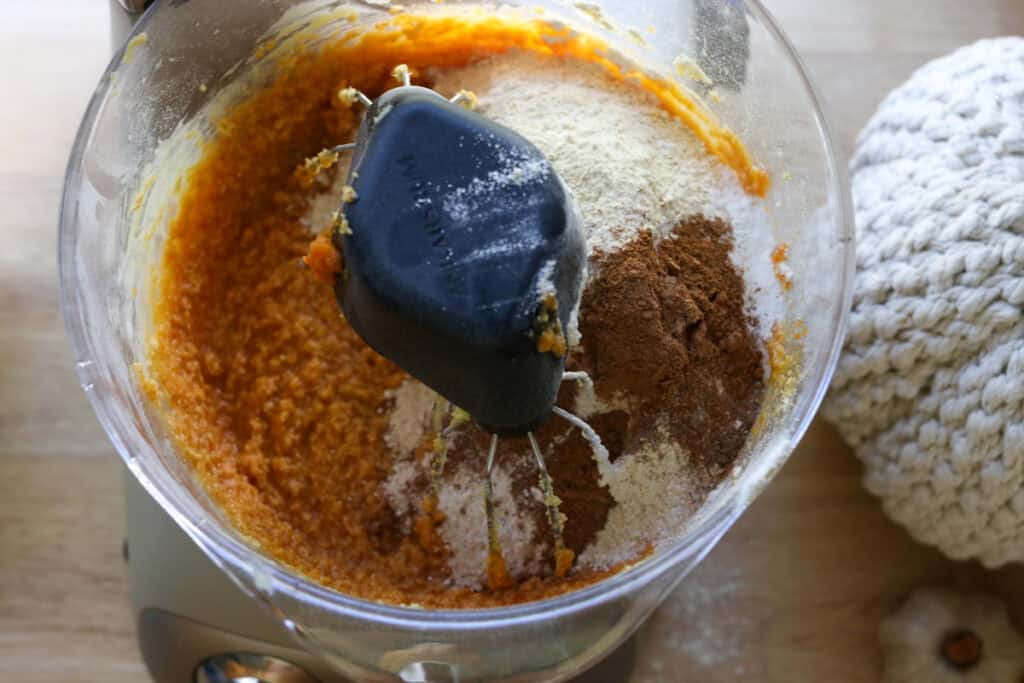 flour, cinnamon, and pumpkin pie spice added to cake batter to make Freshly Milled Pumpkin Spice Latte Cake with Frosting