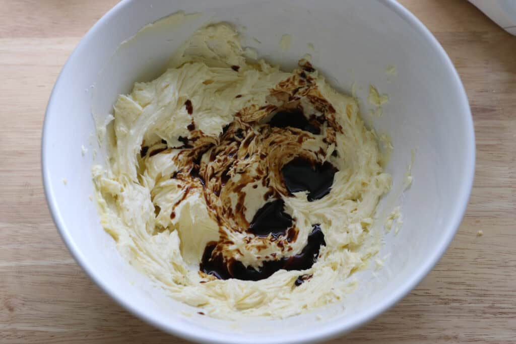 adding the espresso to the spiced frosting for the freshly milled pumpkin spice latte cake