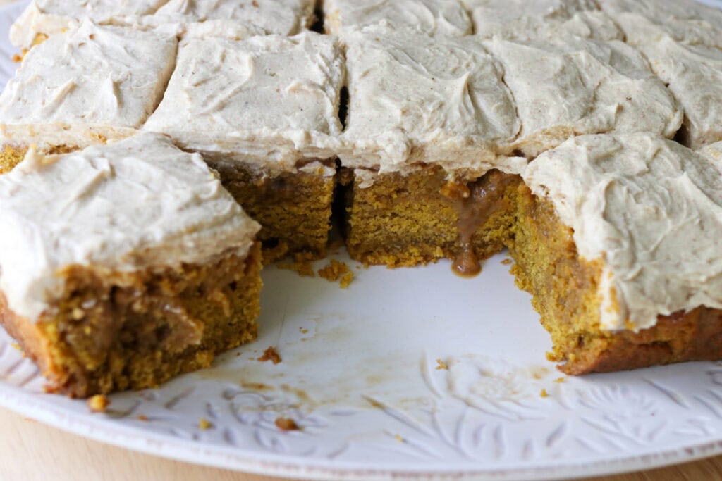 freshly milled pumpkin spice latte cake bars topped with espresso frosting and covered with a latte soak