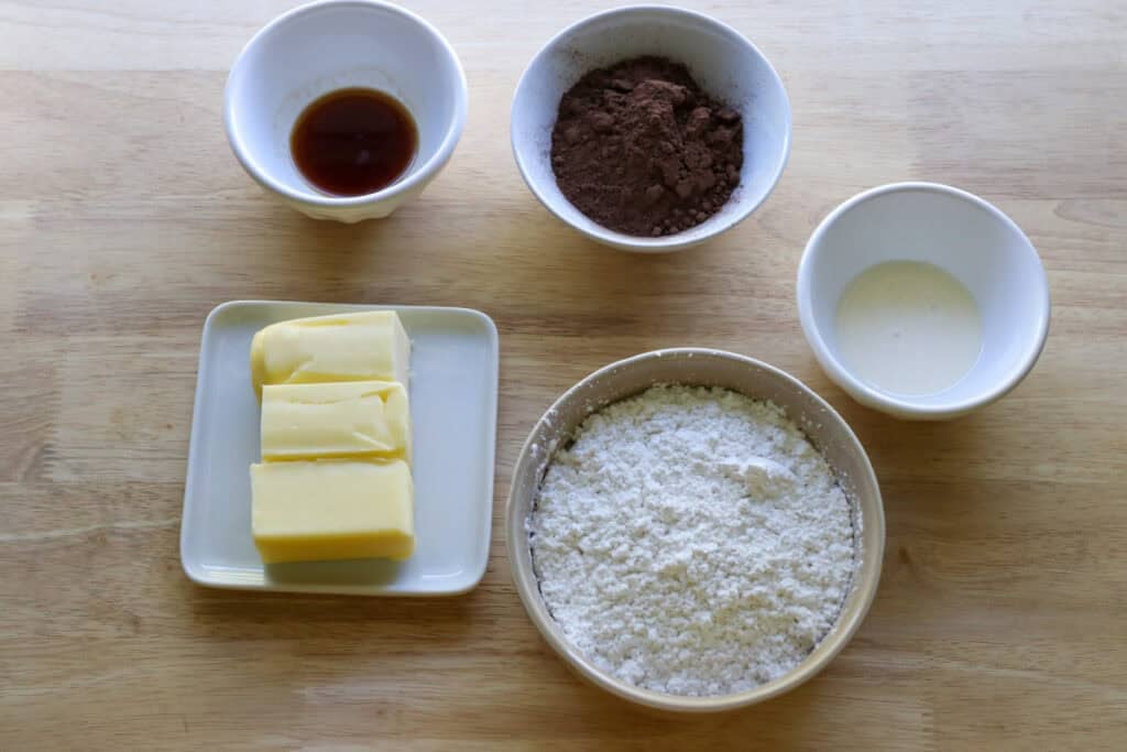 ingredients to make chocolate buttercream for Fresh Milled Hot Cocoa Cupcakes with Ganache Filling