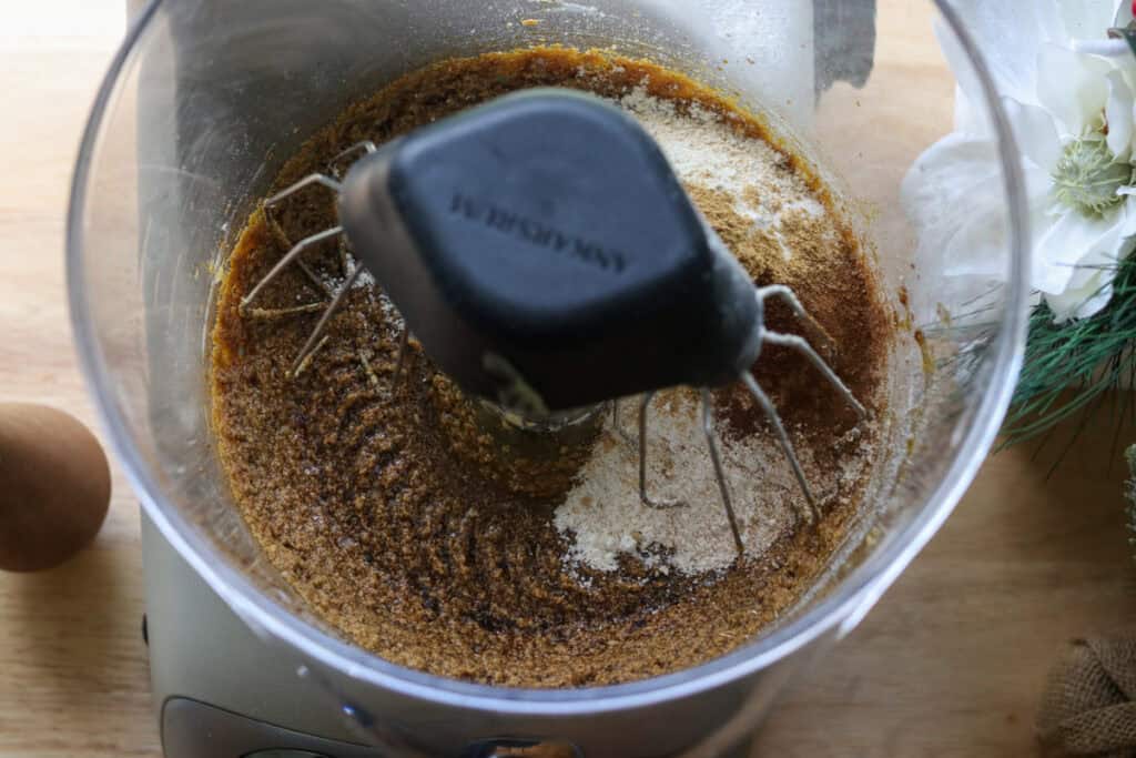 flour and spices in a mixing bowl to make Iced Gingerbread Cookies with Fresh Milled Flour