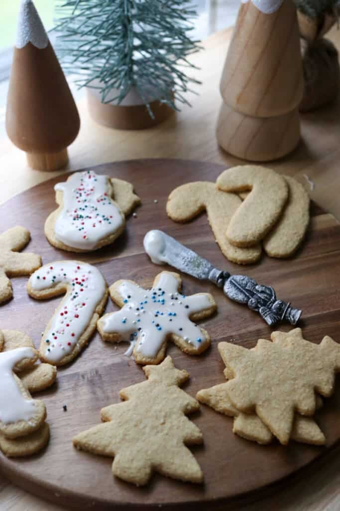 The Best Fresh Milled Healthy Christmas Sugar Cookies with a knife with icing on it