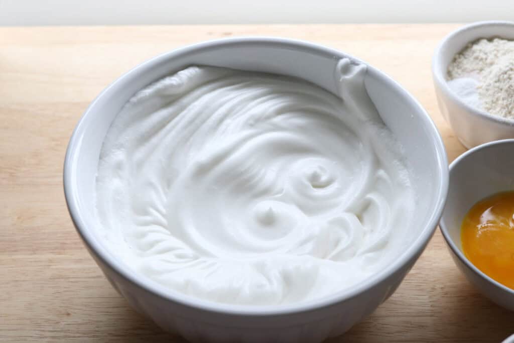 egg whites that have been beaten until thick to make  freshly milled chocolate yule log cake