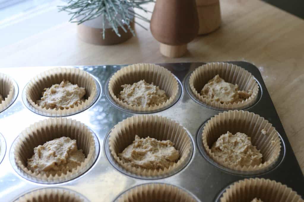 fresh milled eggnog cupcake batter in a cupcake pan