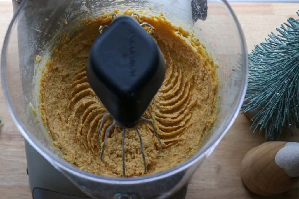 fresh milled eggnog snickerdoodle thumbprint cookie dough in a mixing bowl 