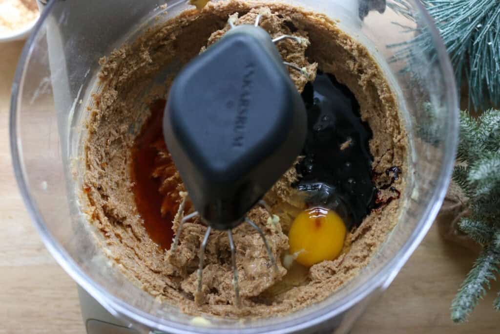 eggs and molasses in a mixing bowl to make Frosted Gingerbread Cookies with Freshly Milled Flour