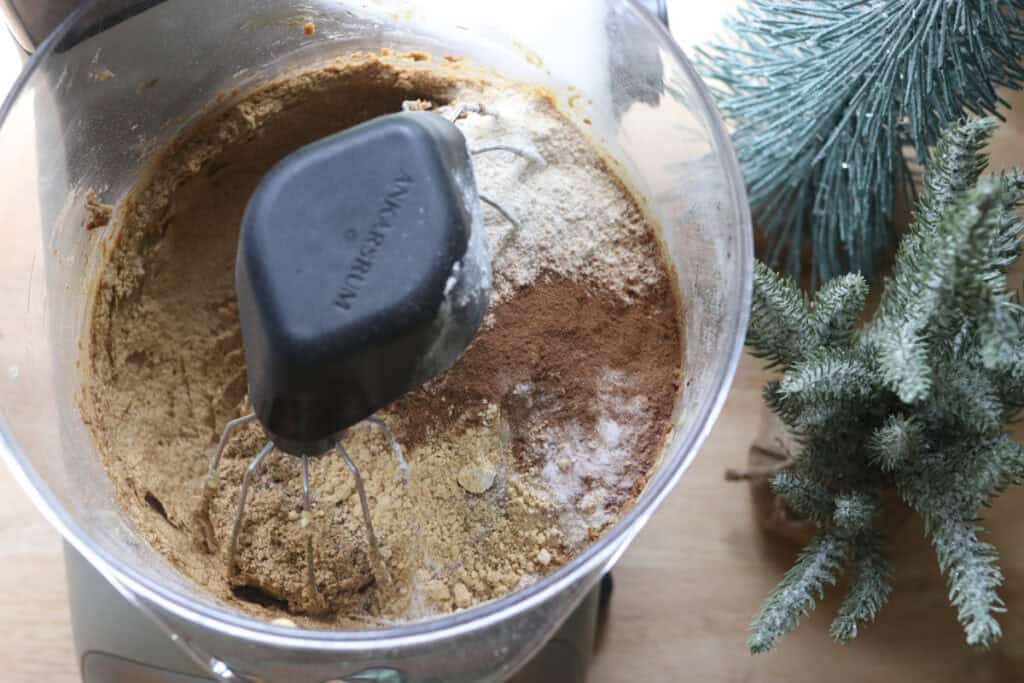 flour and spices added to a mixing bowl to make Frosted Gingerbread Cookies with Freshly Milled Flour