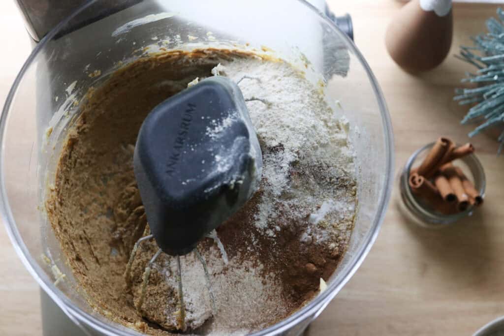 flour and spices added to the batter to make freshly milled gingerbread crinkle cookies