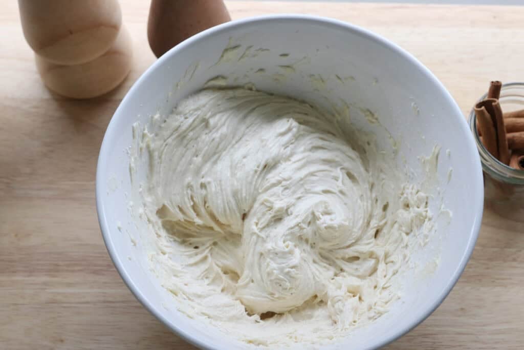 frosting in a white bowl for the Frosted Gingerbread Cookies with Freshly Milled Flour