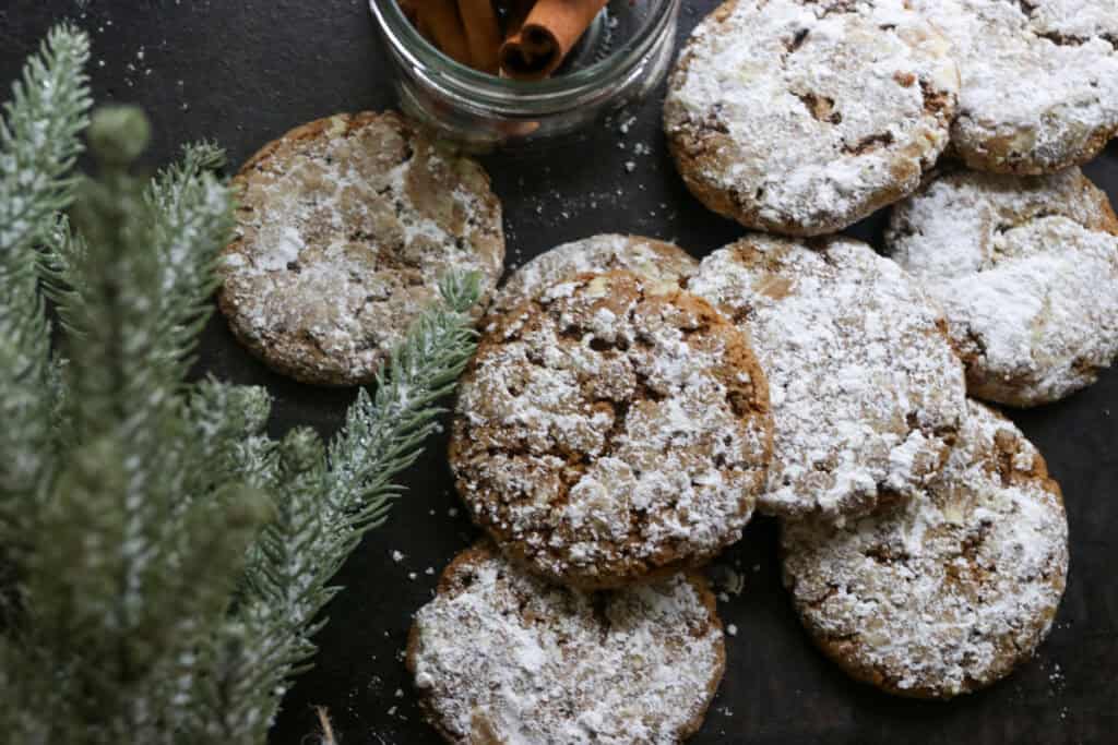 freshly milled gingerbread crinkle cookies with powdered sugar on top
