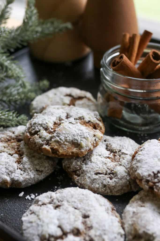 freshly milled gingerbread crinkle cookies with cinnamon sticks in a jar