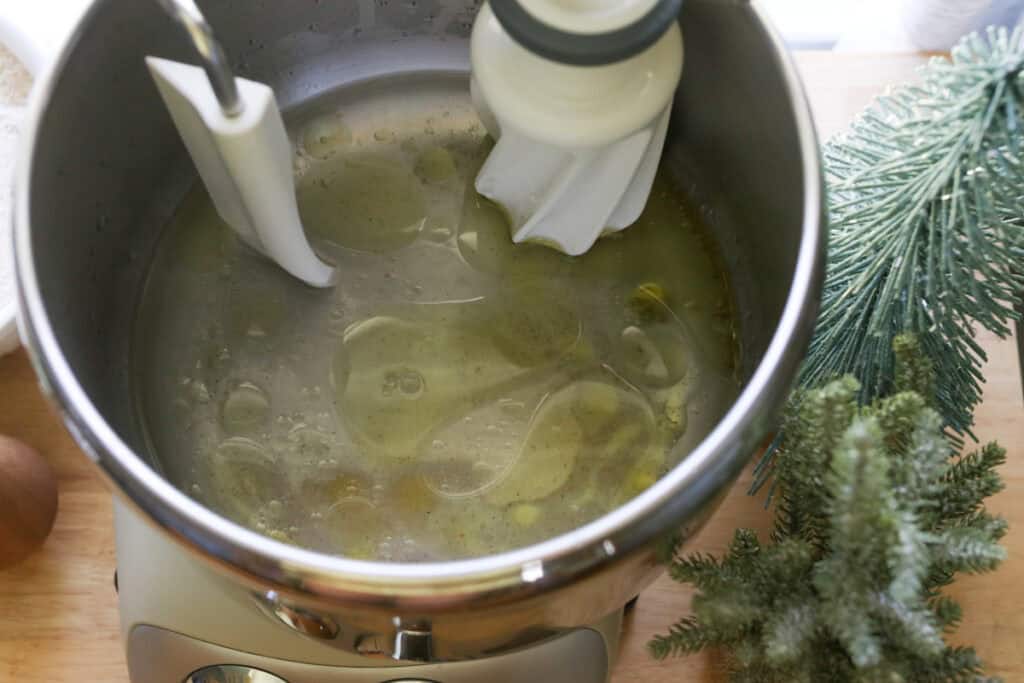 oil and water in a mixing bowl to make Easy Garlic Herb Focaccia with Fresh Milled Flour