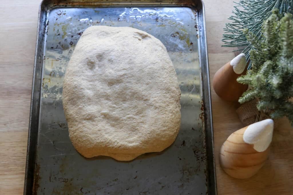 the dough for Easy Garlic Herb Focaccia with Fresh Milled Flour on an oiled baking sheet