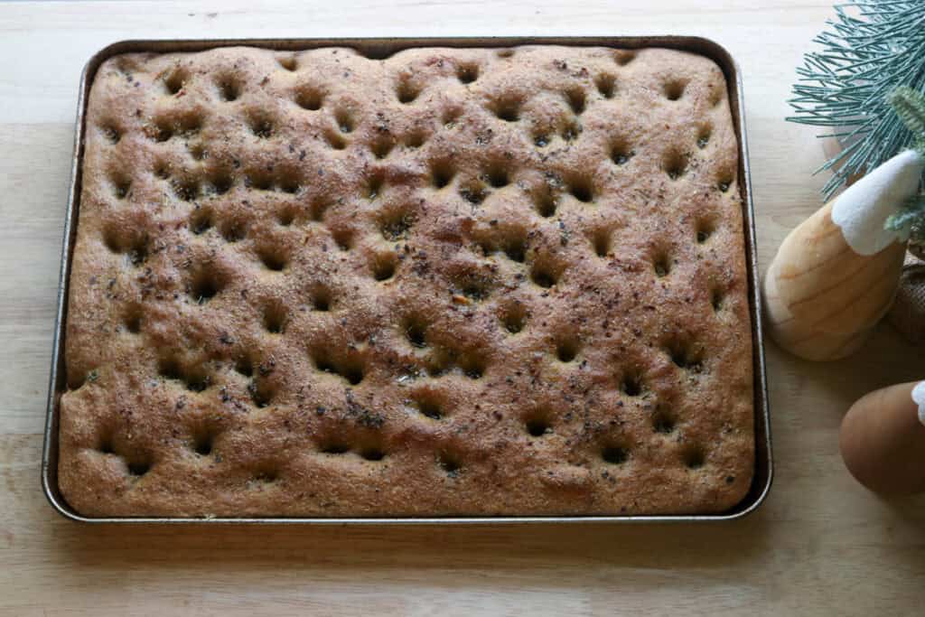 Easy Garlic Herb Focaccia with Fresh Milled Flour that has been baked on a baking sheet