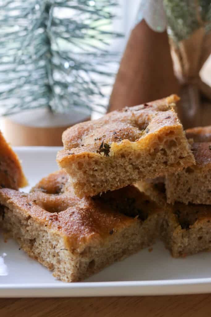 fresh milled garlic and herb focaccia with herbs on top and christmas trees