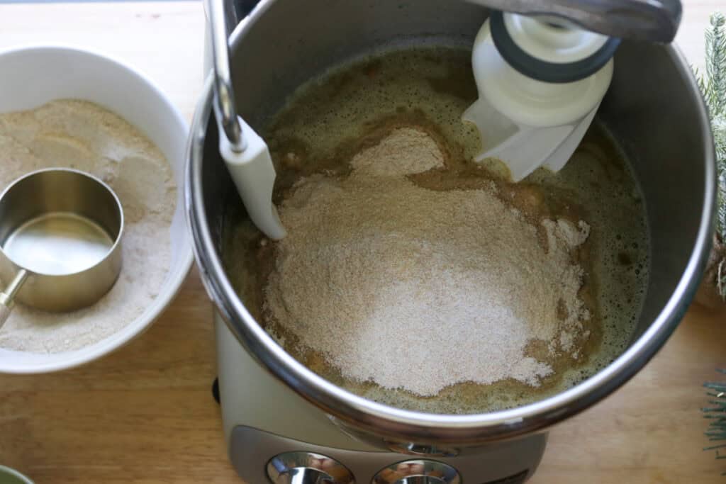 flour added to a mixing bowl to make the Fresh Milled Christmas Tree Garlic and Herb Bread