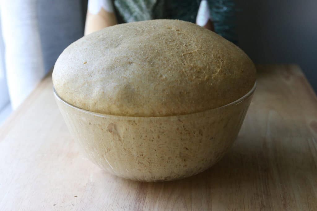 Fresh Milled Christmas Tree Garlic and Herb Bread dough that has risen in a glass bowl