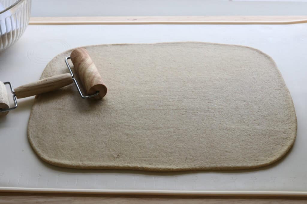 dough for Fresh Milled Christmas Tree Garlic and Herb Bread that has been rolled into a rectangle