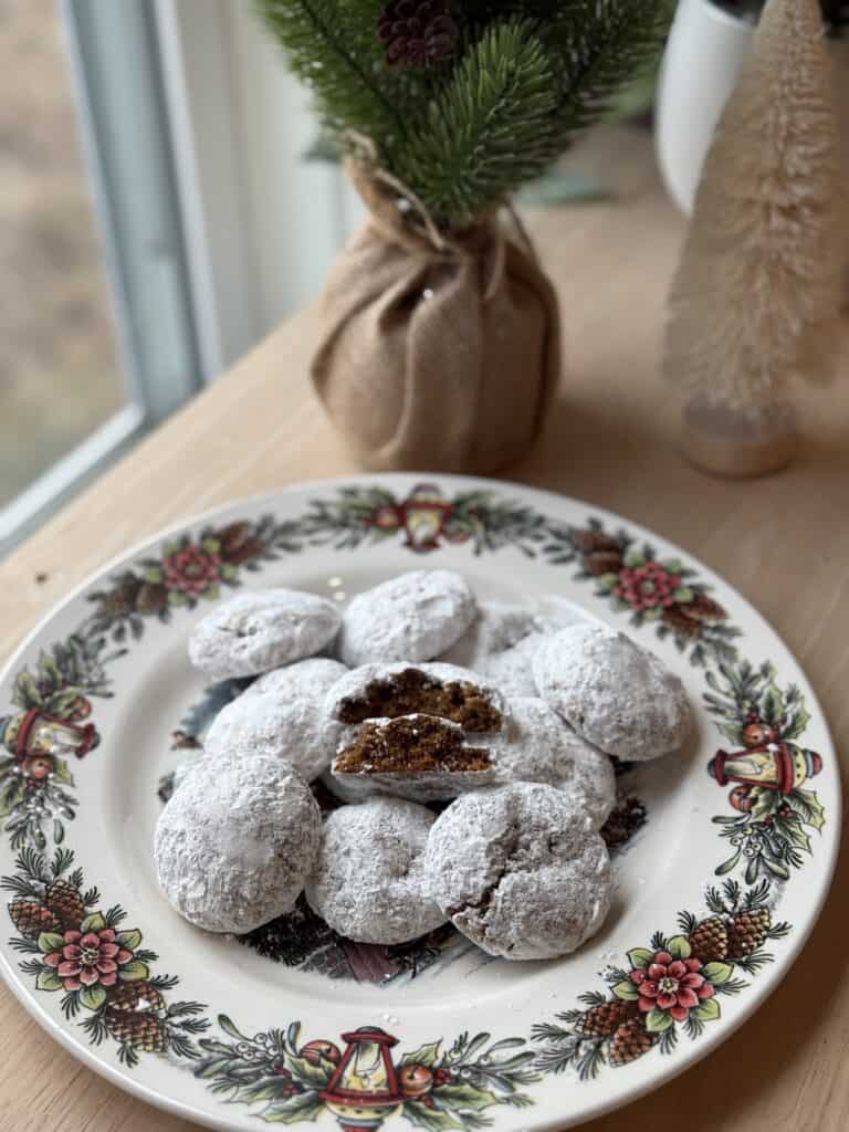 German Pfeffernusse Cookies with Fresh Milled Flour on a holiday plate with a tree behind it