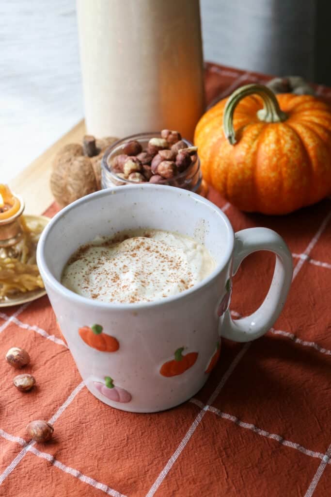 coffee that has naturally sweetened hazelnut coffee creamer in it topped with whipped cream and cinnamon