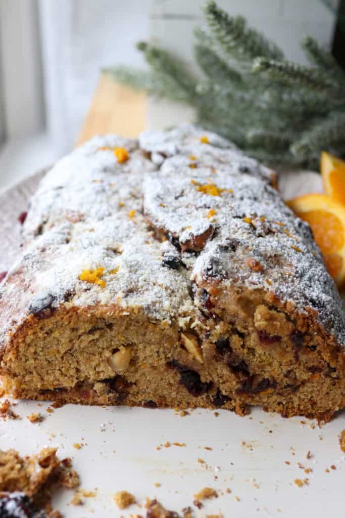 fresh milled Christmas Stollen bread with dried berries and nuts inside of it