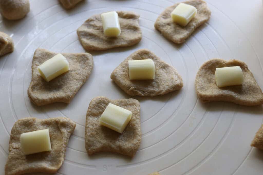 pieces of fresh milled dough stuffed with mozzarella cheese