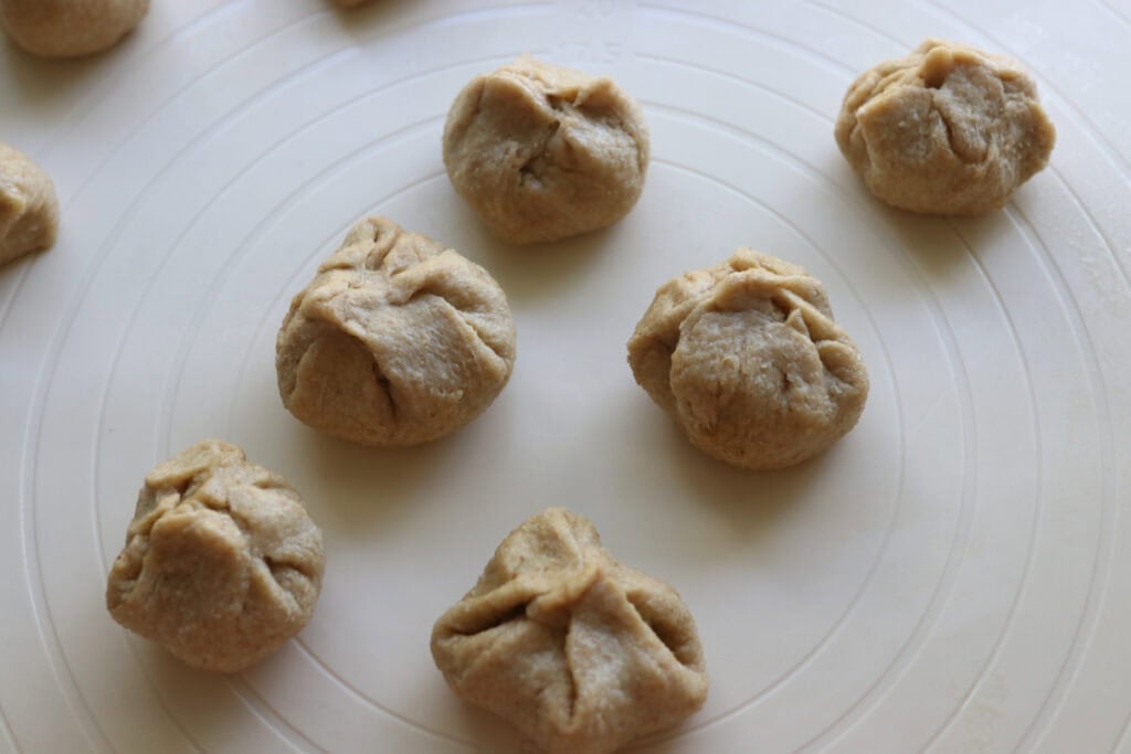 fresh milled dough balls with cheese in the middle