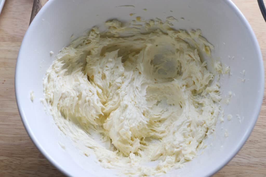 butter and cream cheese mixed together to make the filling for No-Bake Mini Christmas Gingerbread Cheesecake Cups