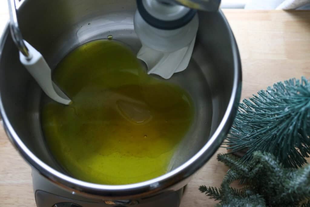 water, oil, and honey in a mixing bowl to make fresh milled cinnamon sugar star bread
