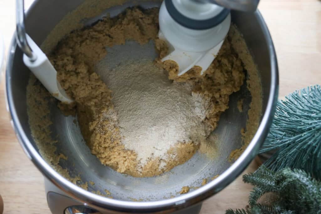 more flour added to dough in a mixing bowl to make fresh milled cinnamon sugar star bread