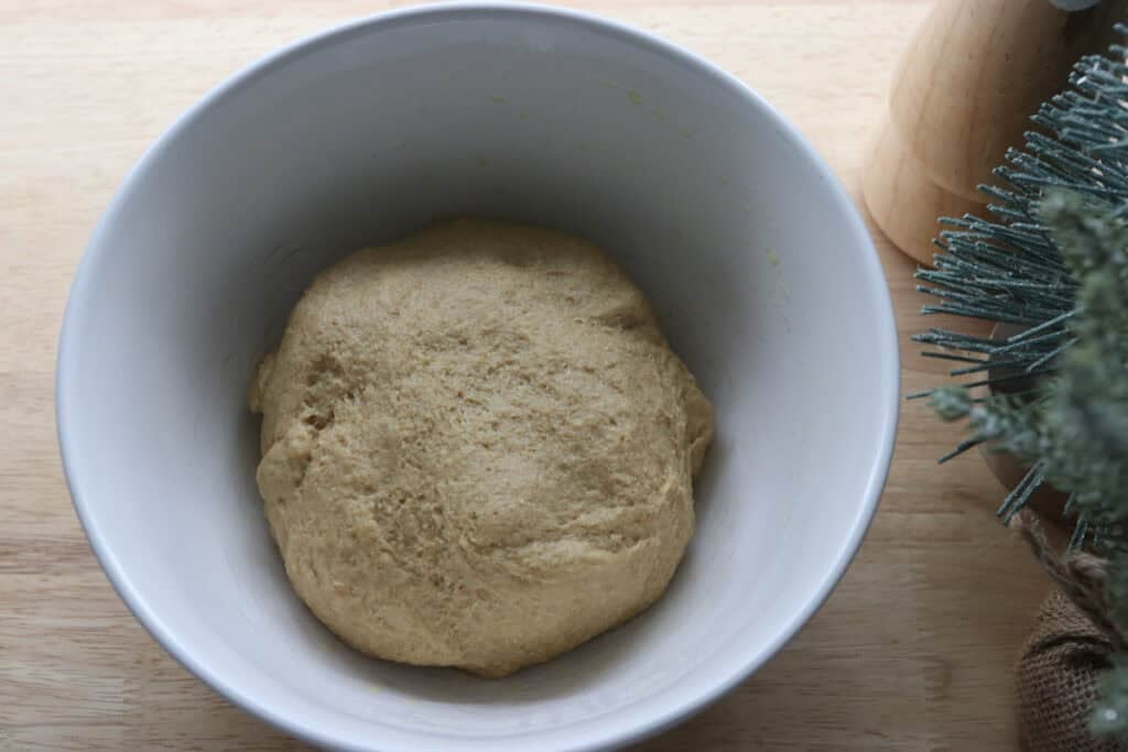 fresh milled cinnamon sugar star bread dough in a white bowl to rise
