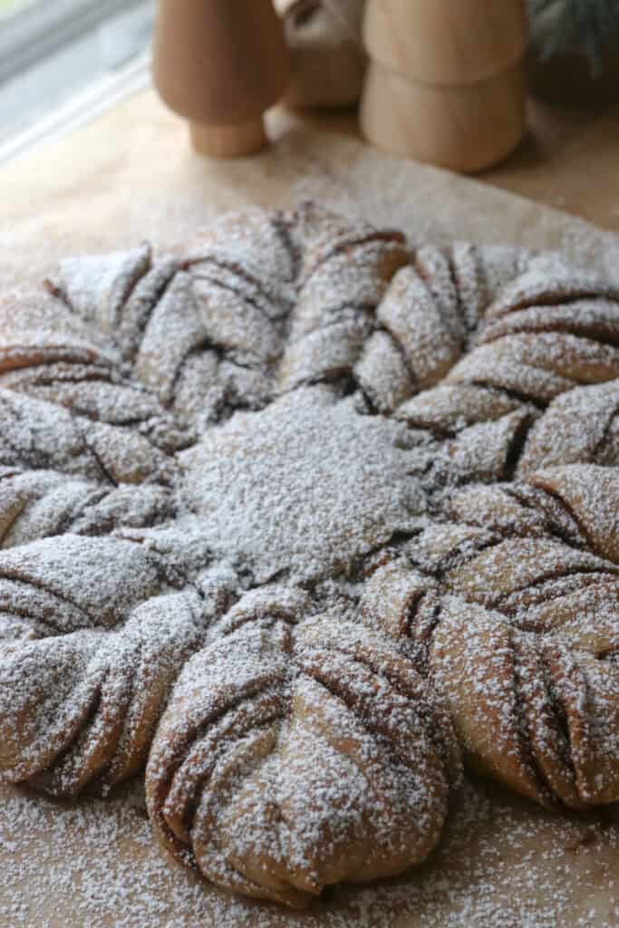 fresh milled cinnamon sugar star bread that has been sprinkled with powdered sugar