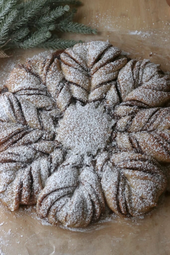 fresh milled cinnamon sugar star bread on a wooden board with greenery