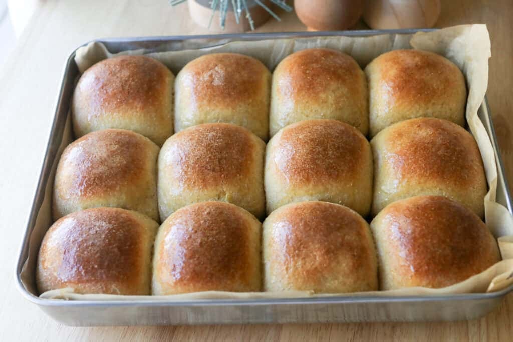 fresh milled fluffy Christmas dinner rolls that have been baked and covered with butter