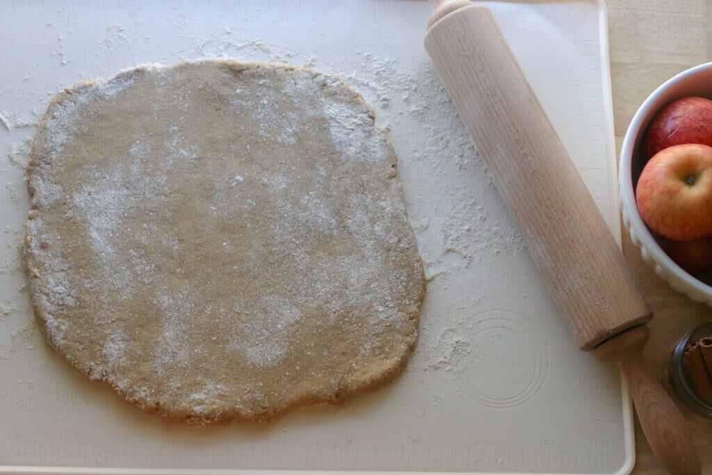 fresh milled apple cider donut dough that has been rolled out