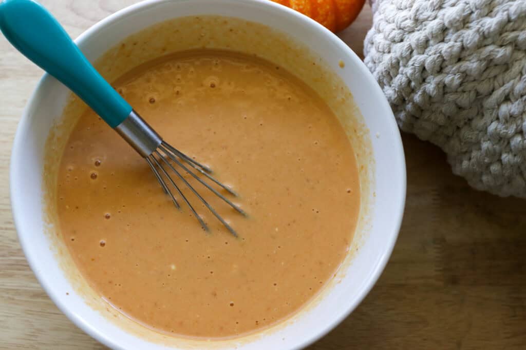 ingredients in a white bowl that have been mixed together to make Healthy High Protein Baked Pumpkin Spice Oatmeal