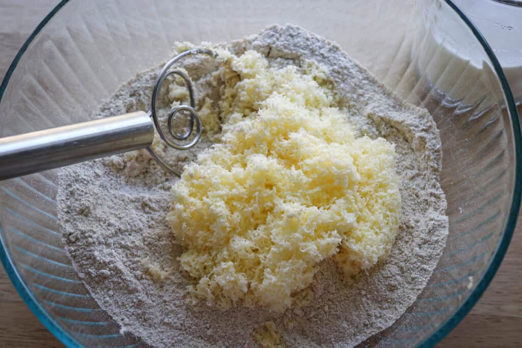 shredded butter and flour to make the biscuit dough for freshly milled breakfast casserole 