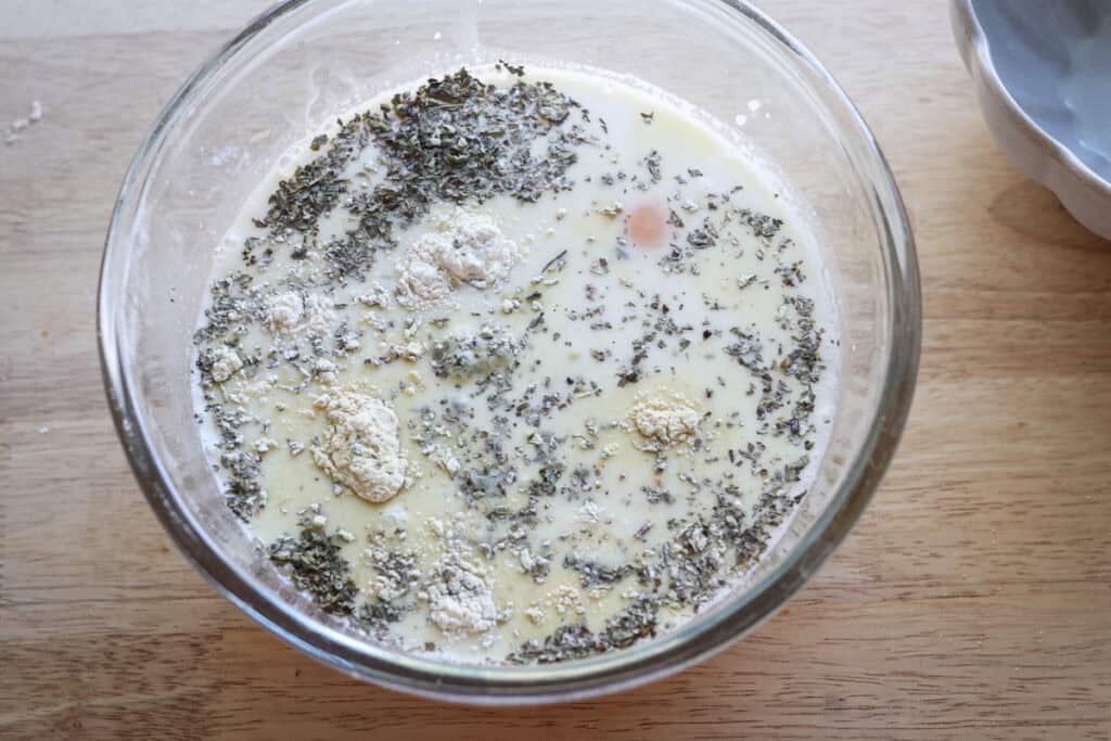 egg and milk in a bowl to make the freshly milled breakfast casserole 
