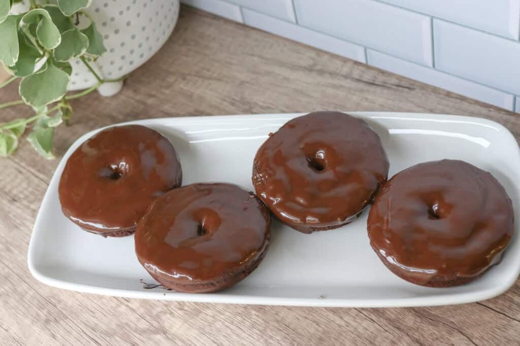 Healthy High Protein Chocolate Donuts with Glaze on a white plate