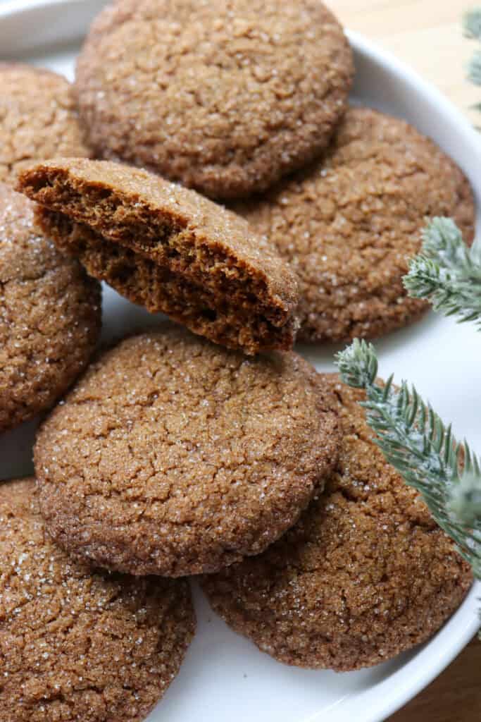 fresh milled gingersnap cookies covered in sugar on a white plate