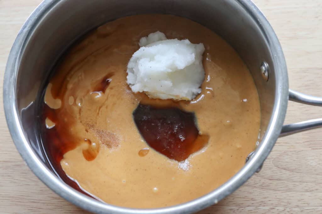coconut oil, peanut butter, and maple syrup in a saucepan to make 4-Ingredient Healthy Peanut Butter Fudge