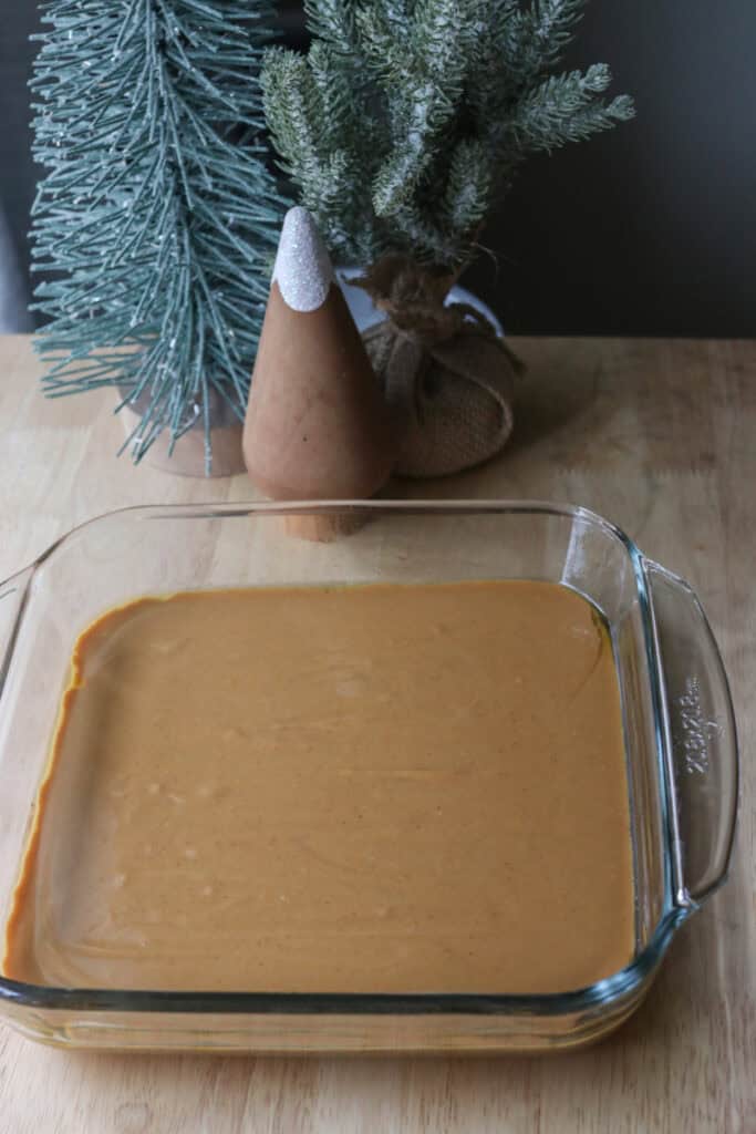 4-Ingredient Healthy Peanut Butter Fudge batter poured into a glass pan
