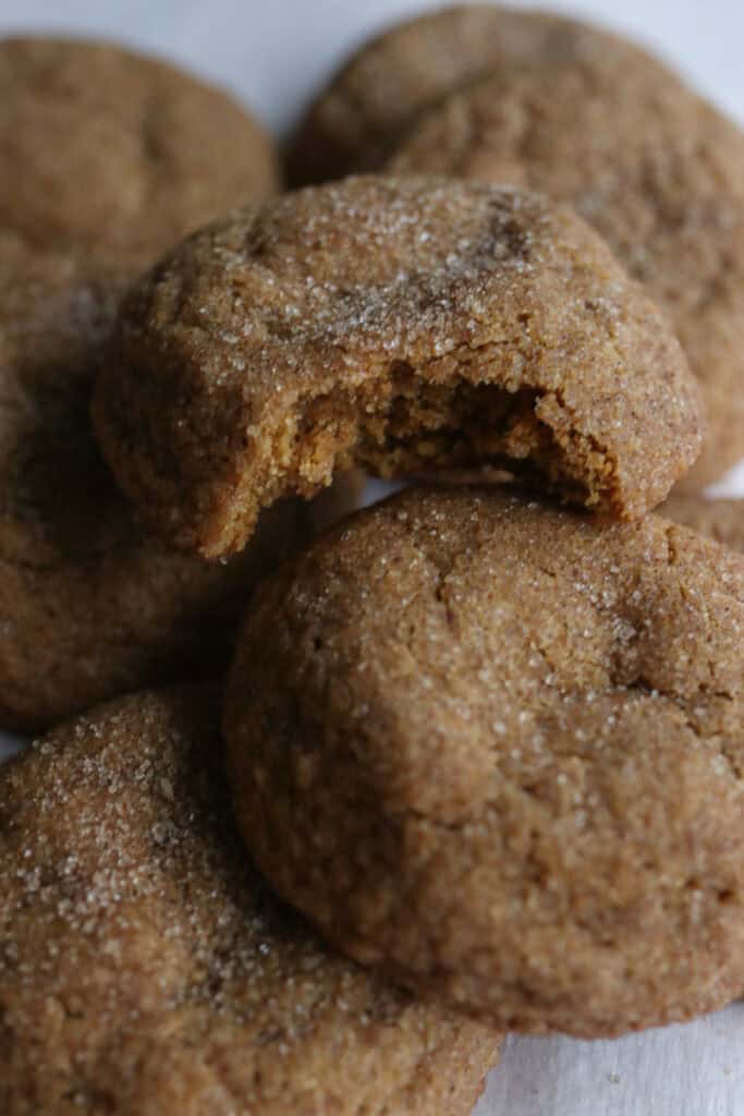 a bite taken out of a Freshly Milled Brown Butter Maple Pumpkin Cookie 