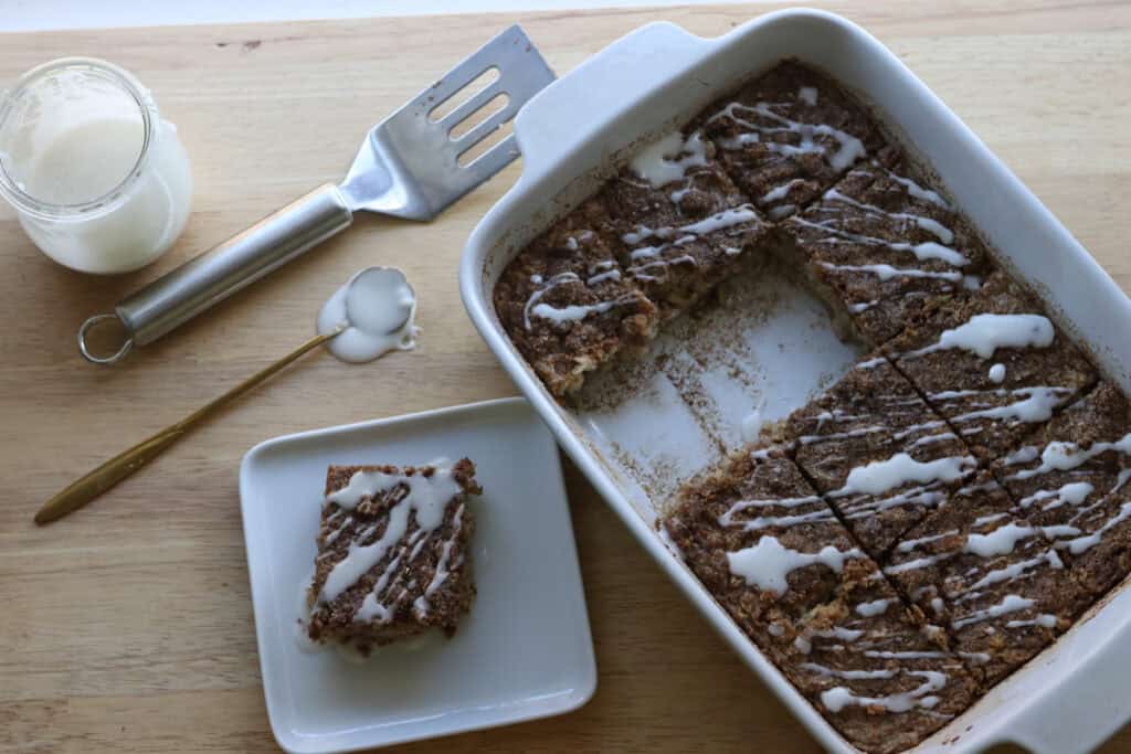 Healthy Cinnamon Coffee Cake Baked Oatmeal Recipe cut into squares with one on a plate