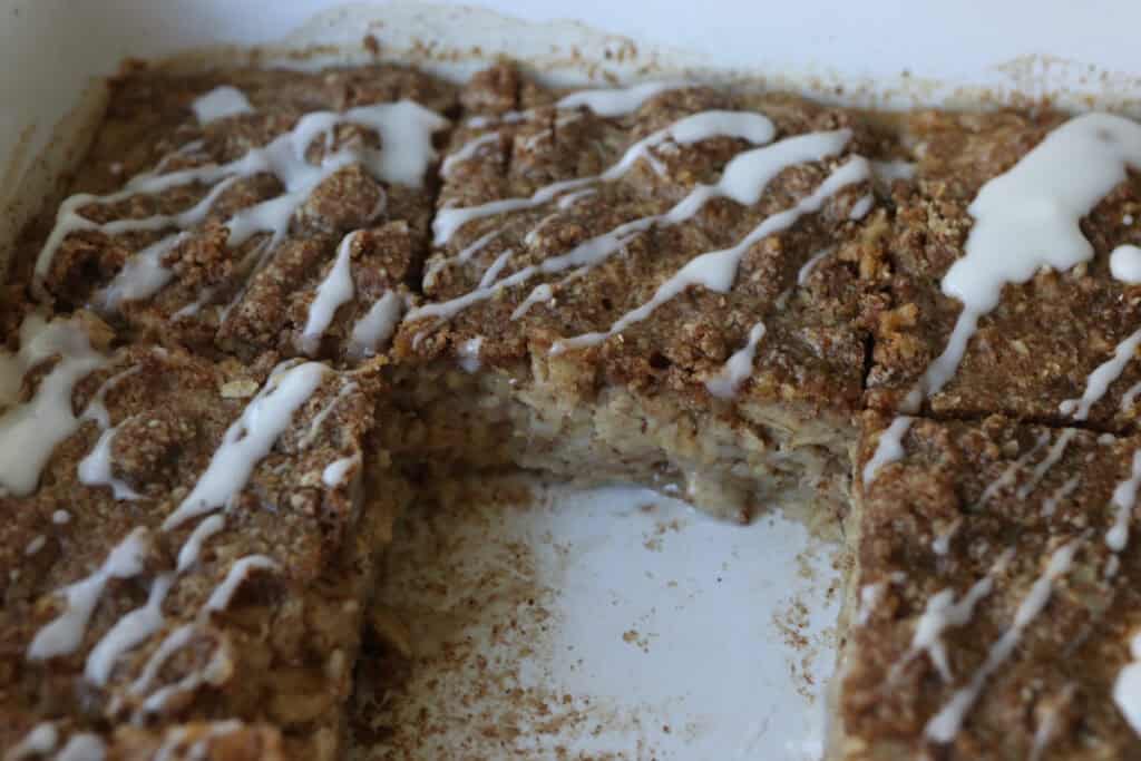 Healthy Cinnamon Coffee Cake Baked Oatmeal with glaze and cinnamon crumble on top