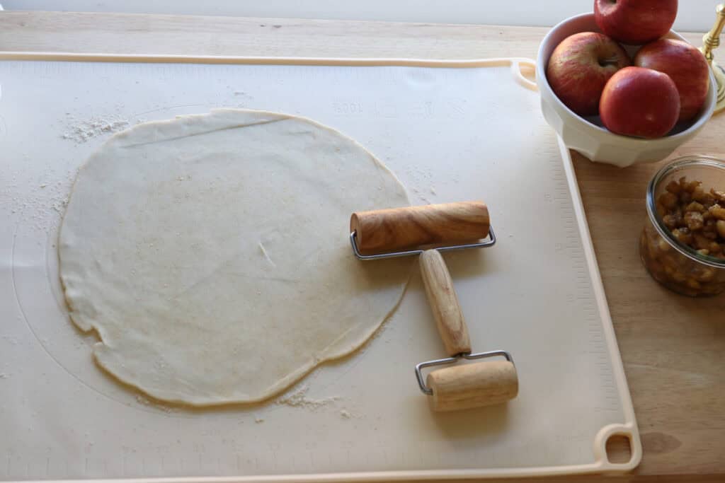 freshly milled pie crust that has been rolled out to make freshly milled healthy apple hand pies